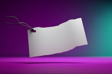 Blank Torn Paper Tag Floating Against Colorful Studio Backdrop. Mock up promotion information for marketing announcements and details, blank white space