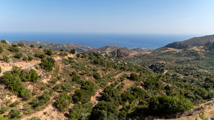 Breathtaking view of the hills and coastline in Crete, Greece on a clear sunny day