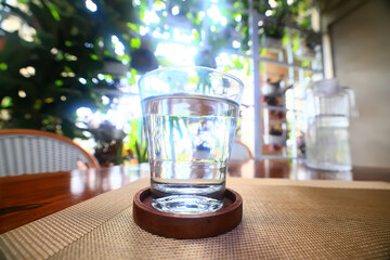 a glass of cold water on the table in the restaurant
