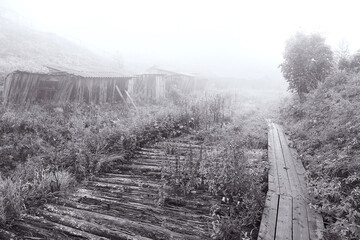 an old wooden fence in a village in Russia