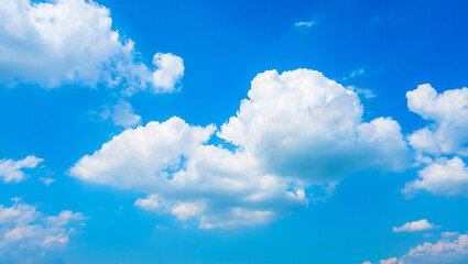 White clouds against bright blue sky fluffy
