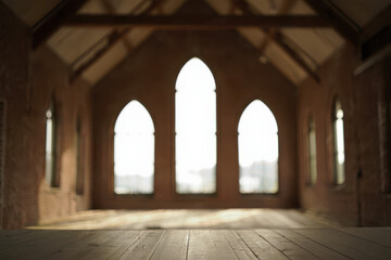 Interior view of an empty church with arched windows and wooden floor in soft focus light setting