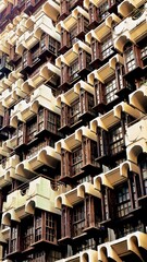facade of a building with a peculiar contemporary construction in wood and stone