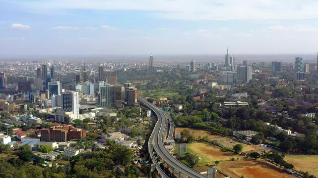 Aerial view of modern skyline with expressway and skyscrapers, Nairobi, Kenya.