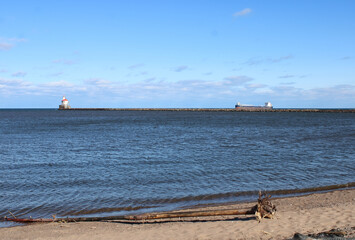 Lighthouse and Ship at Superior Entry Observation Area on Lake Superior at Superior, Wisconsin on...