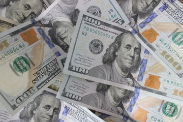 Dollars banknotes on wooden table. Top view. Business background.