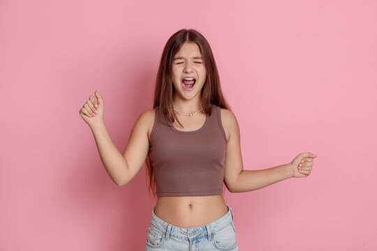 Fototapeta Portrait of teenage girl on pink background