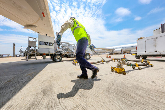 Refueling planes at the airport