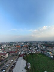 Aerial view of the city with blue sky