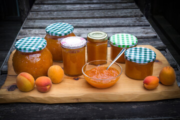 harvest of apricots - cooking homemade apricot jam and conservation in a glass