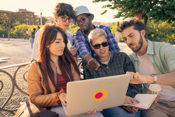 Happy diverse group of friends walking together towards camera at sunset. Concept of community, life's journey, moving forward to the future, unity and support.