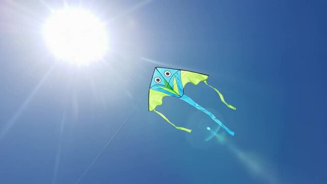 Colorful kite in a bright blue sky
