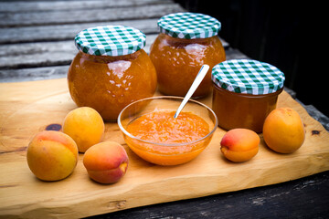 harvest of apricots - cooking homemade apricot jam and conservation in a glass