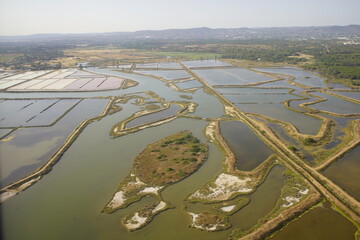 The Ria Formosa in Portugal features traditional sea salt production in shallow pools called 