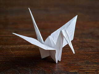 Origami Crane on Wooden Table.