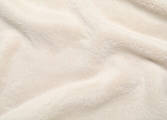 ivory white fleece texture close up view wrinkled cream color fur abstract background