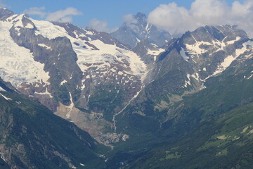 mountain peaks of the North Caucasus in Dombay on a sunny summer day