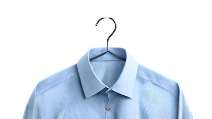 A light blue dress shirt hanging on a black hanger against a dark black studio backdrop for a clean look
