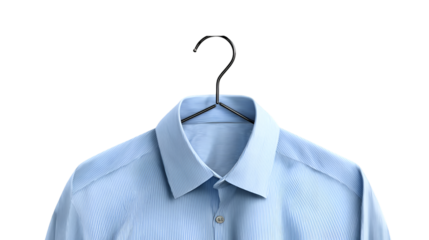 A light blue dress shirt hanging on a black hanger against a dark black studio backdrop for a clean look