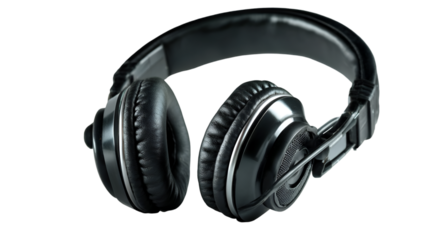 A close up shot of black over ear headphones with leather earcups on a black background studio shot