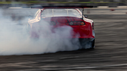 Car drifting, Blurred image diffusion race drift car with lots of smoke from burning tires on speed track, Car drifting on speed track, Professional driver drive drifting car.