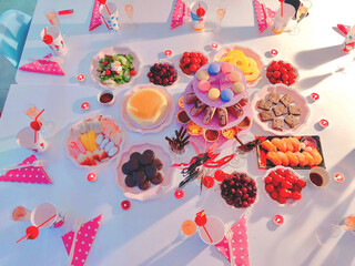 Top View of a Bridal Shower Dessert Table with Colorful Sweets and Drinks