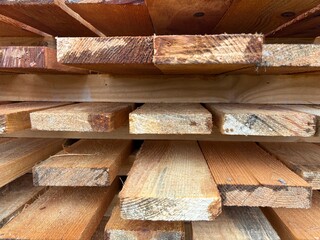 Finished boards are stacked on top of each other. Texture of boards for construction and finishing...