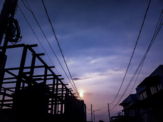 Unfinished two floors construction at housing complex in Sidoarjo with electricity cable hanging...