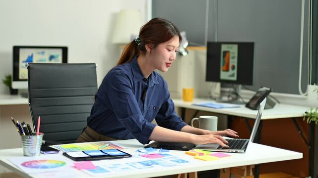 UX UI designer planning mobile layout with sticky notes in modern office. Creative brainstorming and prototyping workflow.