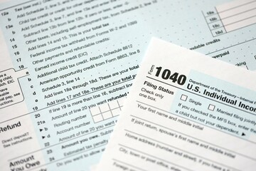 1040 US individual income tax return form blank close up. Few pages of united states tax blank