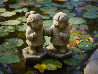 Obraz premium stone statue in a garden