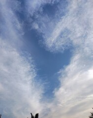 Obraz premium silhouette of a Magical heart shaped clouds in a blue sky