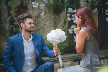 Surprise proposal young couple lover boyfriend give flower Bouquet to beautiful girlfriend to will...