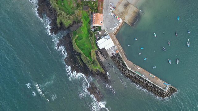 Aerial view of coastline and fishing boats, Spain.