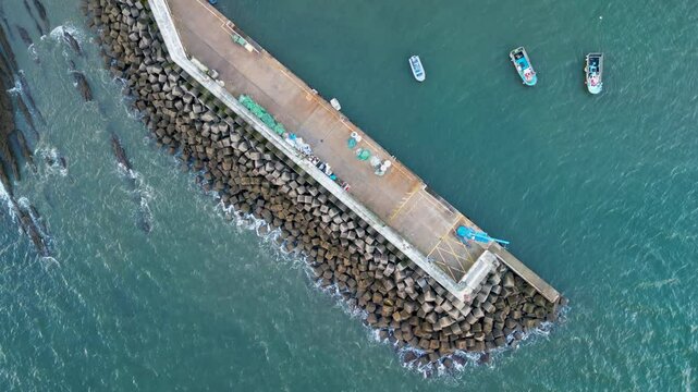 Aerial view of Panxon Seafront with pier and boats, Spain.