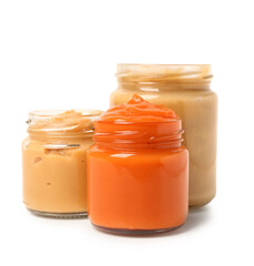 Jars of healthy baby puree isolated on white background