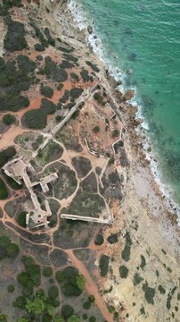 Aerial view of historic ruins on a cliff, Portugal.