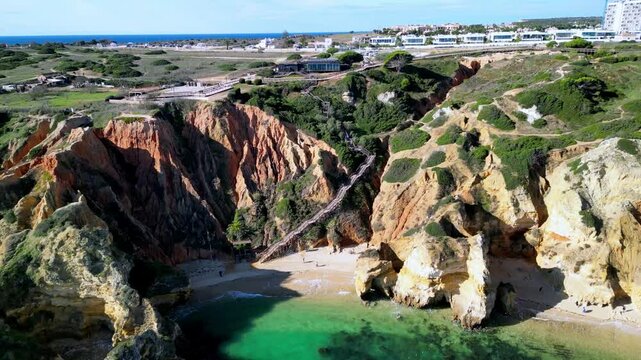 Aerial view of Praia do Camilo Beach and cliffs, Portugal.