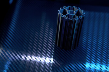 Innovative 3D Printer Creating a Detailed Component in a Dark Workshop Environment With Advanced Lighting