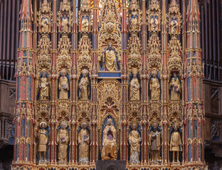 PIACENZA, ITALY - MAY 19, 2025: The carved polychrome main altar of Cathedral - Santa Maria Assunta e Santa Giustina by Antonio Burlengo (1443 - 1447).