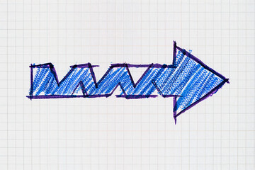 A blue crayon drawing of a right pointing arrow on a graph paper background