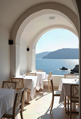 Obraz premium Elegant Seaside Restaurant Terrace: Tables Dressed in White with Clear Glassware and Wooden Chairs Under White Arches, Offering Breathtaking Ocean Views for a Romantic Outdoor Dining Experience. 