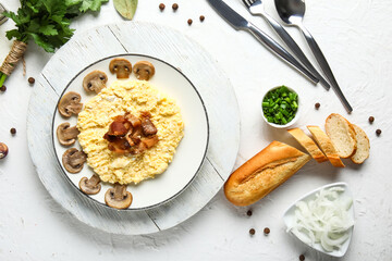 Plate of tasty banosh, onion and bread on white background