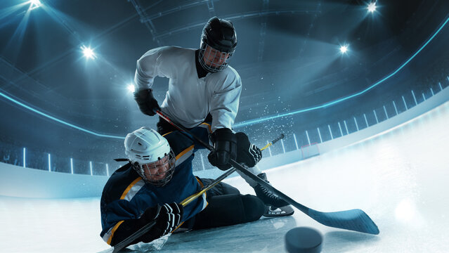 Dynamic shot of hockey players battling for the puck, captured at the moment of contact in an 3D arena. Concept of high-stakes sports, action in motion and game dynamics