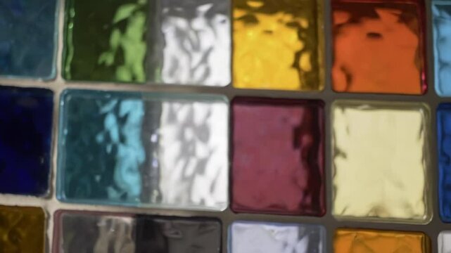 Colorful square glass blocks create abstract pattern and texture