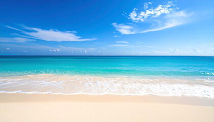 Obraz premium Tranquil beach scene with turquoise water and a bright blue sky.