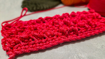 Pattern for knitting a bag. Crocheted from polyester cord. On a gray background