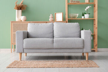 Soft sofa with carpet in living room
