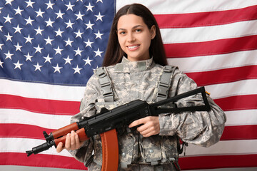 Female soldier with assault rifle against USA flag background