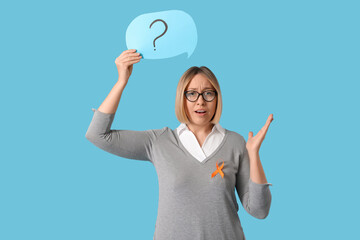 Shocked mature woman with ribbon and speech bubble on blue background. Multiple Sclerosis Awareness...